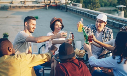 patrons enjoying drinks on a high-rise terrace